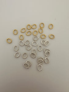 Oval Shape Twisted Rings | About 125 Pcs. | Gold Finish and Silver Plated | Closed Rings | Decorated | Size: 6mmX7mm .