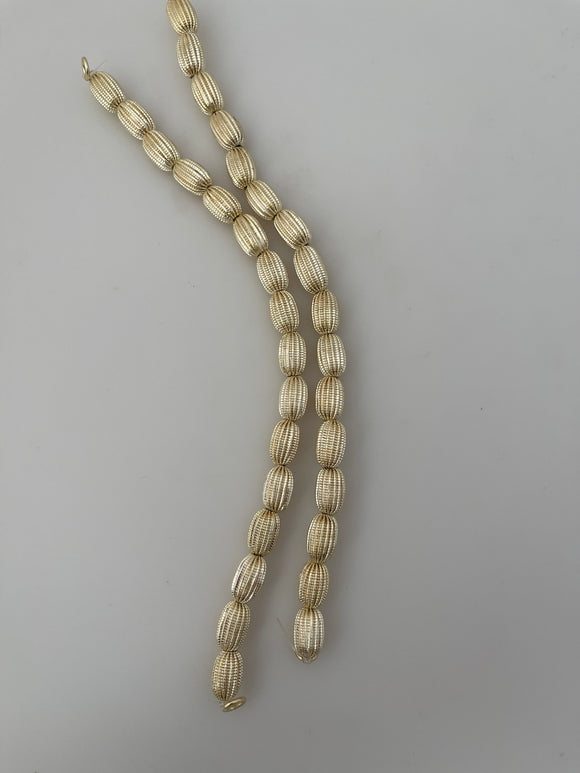 1 Strand of Brushed  Fancy Gold Finish Beads  E-coated Beads. Size :12mmX8mm