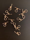 A Pack of 20 pieces of Decorated Toggles, E-Coated, Designer's Toggles 2 Colors Gold finish and Silver Plated.