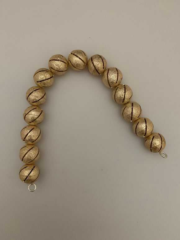 1 Strand of Brushed Finish Fancy   Round Gold Finish Beads , E-coated Beads. Bead Size is: 15mm