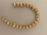 1 Strand of Brushed Finish Fancy Shiny Round Gold Finish Beads , E-coated Beads. Bead Size is: 10mm