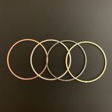 A Pack of Gold Plated Rings, that are E-Coated and Brushed Finished. You can find 4 colors with various different sizes.